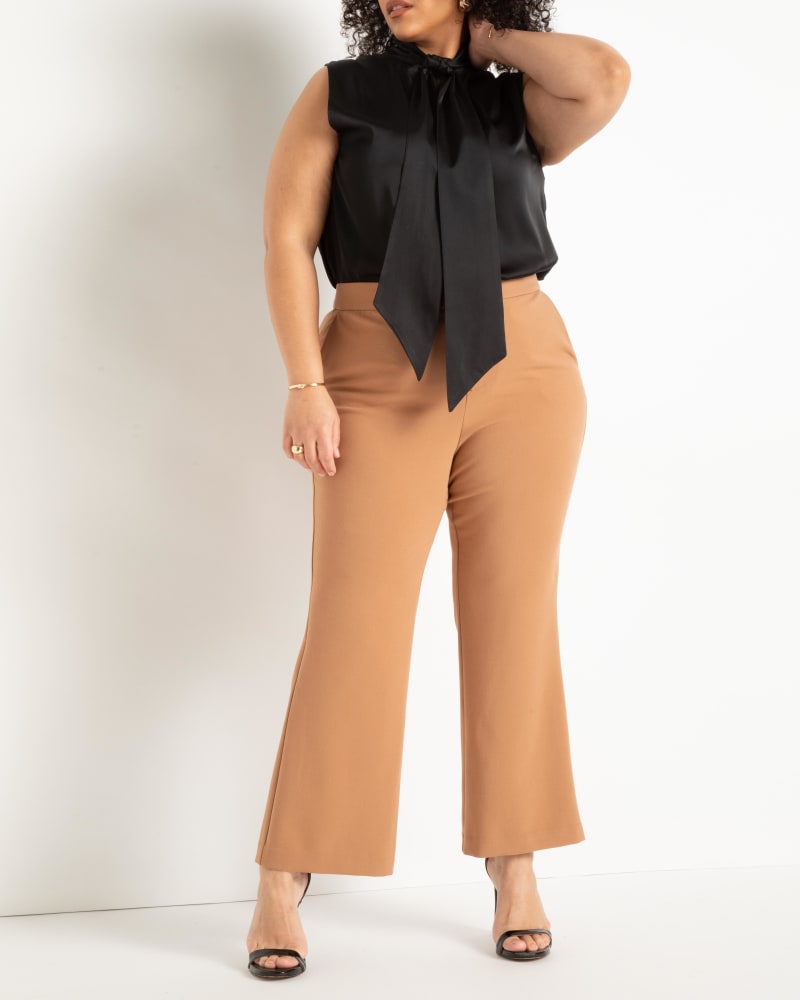 Front of a model wearing a size 28 The 365 Suit Crop Flare Leg Trouser in Biscuit by ELOQUII. | dia_product_style_image_id:272934